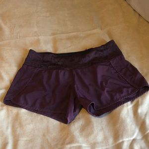 Burgundy Lululemon.  Black spiderweb design, hot pink zipper pocket.  Not lined.